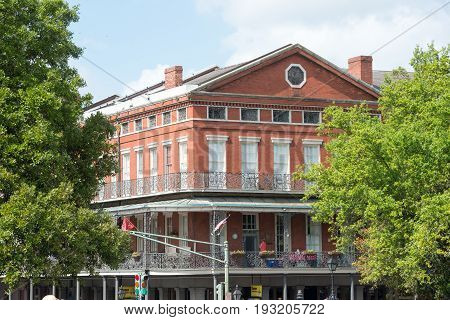 NEW ORLEANS, LA - APRIL 13: View of Street in the French Quarter of New Orleans, Louisiana showing historic buldings with unique architecture on April 13, 2014
