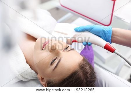 Endermologie. Vacuum mouth enlargement Woman in the clinic of aesthetic medicine.