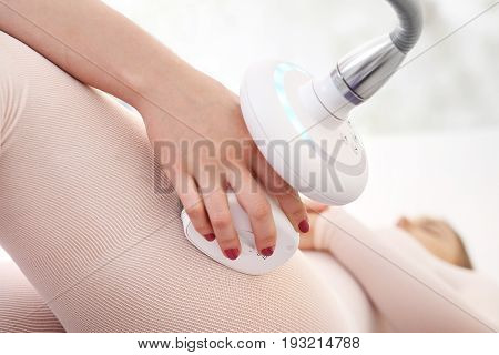 Vacuum massage effective fight with the orange peel on the thighs.