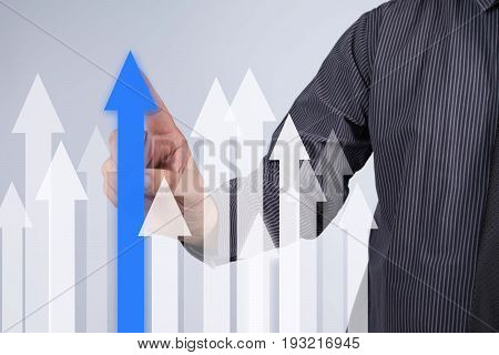 Sales Growth Graph - Businessman hand pressing button on touch screen interface. Business technology internet concept. Stock Photo