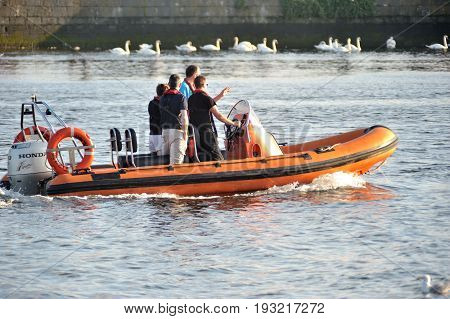 Galway Spanish Arch , Ireland June 2017,river Corrib , Group Of People Sailling A Inflatable Boat Wi