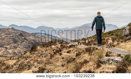 Man And Dog On Torc Mountain