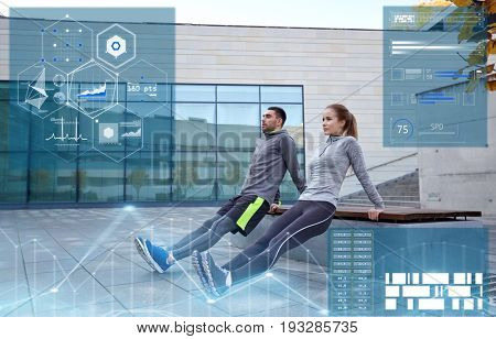 fitness, sport and people concept - couple doing triceps dip exercise on bench outdoors