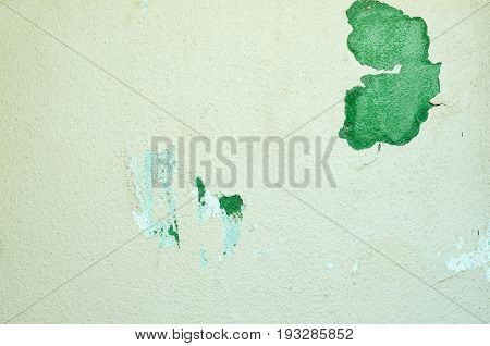 Peeling mortar paint on the exterior wall of house facade.