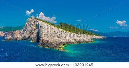 Blue sea and old Lighthouse at Lefkada islands Greece.