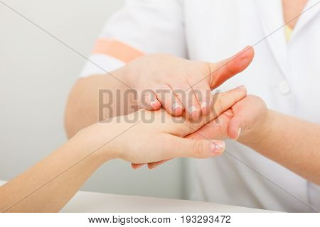 Handcare manicure and pedicure spa wellness treatment concept. Woman getting hand massage at beauty salon
