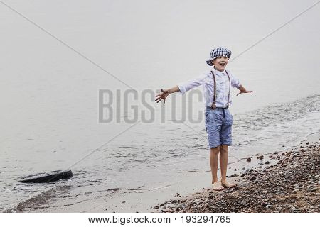 the boy at the top of an old tyre