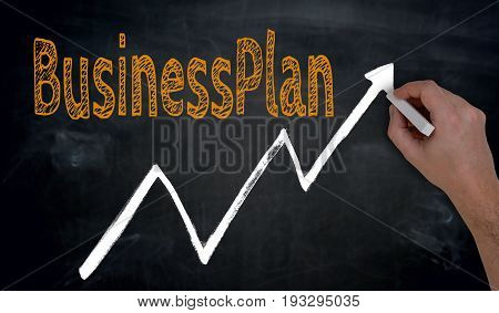 Businessplan And Graph Is Written By Hand On Blackboard
