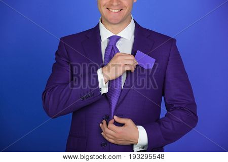 Man With Hands Putting Blank Bank Or Business Card In Pocket