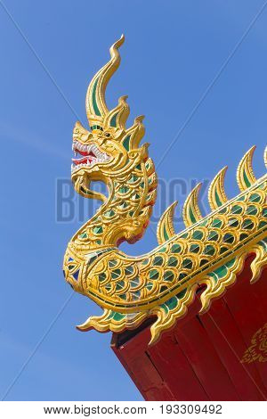 Beautiful Golden Thai Temple Architecture: Naga Wood Carved At Chapel Roof Of Wat Phrathat Hariphunc