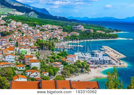 Aerial view on Adriatic Sea and Baska Voda place in Makarska Riviera, Dalmatia region, popular tourist summer resort in Croatia, Mediterranean.