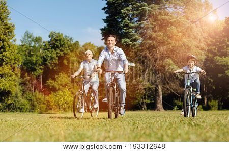 Cool gang. Motivated adventurous positive guys figuring out who being the fastest one while riding the bikes on the park