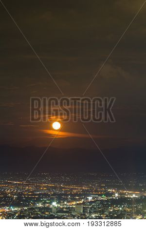 Supermoon Raising Up In The Sky Over The Sky At Night