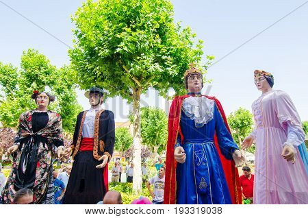 Badajoz, Spain - june 24, 2017: Disguised figures known as giants and big heads,  roughly gigantes y cabezudos parade for the children in the city of Badajoz