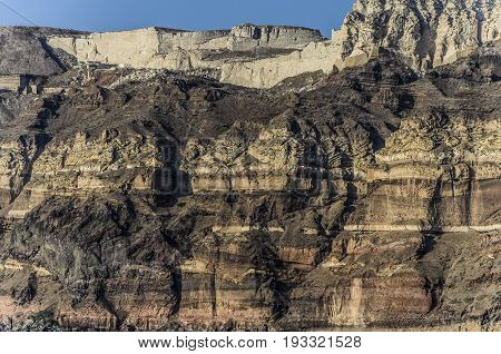 To reach the capital city of the island of santorini we have to ascend the rocky walls of the crater of a volcano.