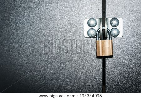 Padlock. Gold padlock on metal door. Close up.