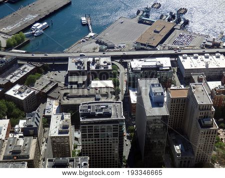 SEATTLE-- JUNE 25: Aerial view of downtown Seattle buildings Ferry Terminal Port boats and I-5 Highway on June 25 2016 in Seattle WA.