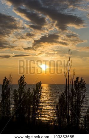 Orange Sunset And Cloudscape Over Clean Blue Lake