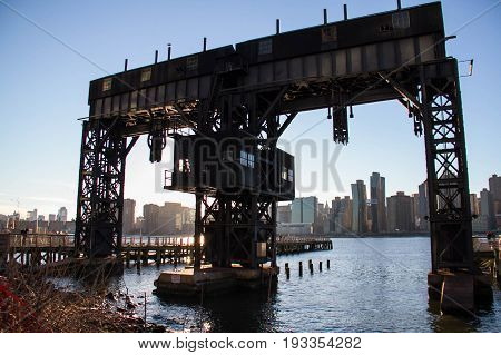 iconic gantries of Gantry State Park on East river and Manhattan city