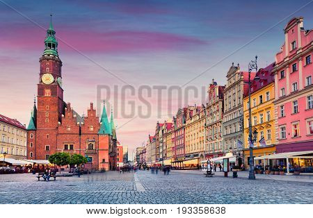 Colorful Evening Scene On Wroclaw Market Square With Town Hall.