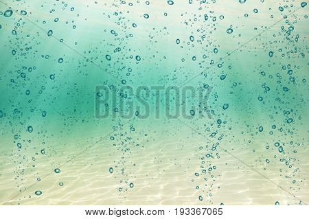 Sea bottom with blue water wave splash background