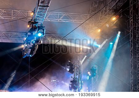 Concert Lighting On Stage. Lighting Equipment With Multicolored Beams.