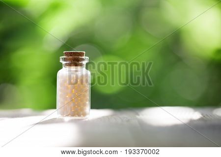 Homeopathy - A homeopathy concept with homeopathic medicine pills
