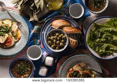 Chickpea soup  Revithia and vegetable stew Briam on the white table top view horizontal