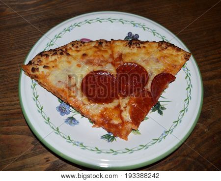 Two slices of pepperoni pizza on a plate