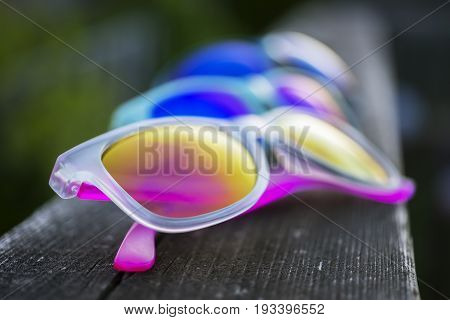 Three Pairs Of Vibrant Sunglasses In Multiple Colors