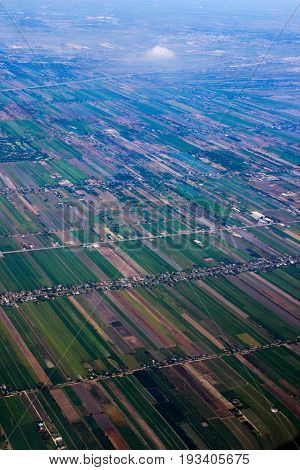 Cumulus cloud and field from airplane view
