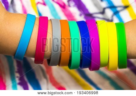 Rubber Bands On Hand. Girls Hand With Bracelets Made Of Rubber Bands. Rainbow Loom Colored Rubber Ba