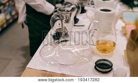 Glass Dripper With Brewed Tea Close-up. Tea Tasting With A Dripper And Kettles Shallow Focus