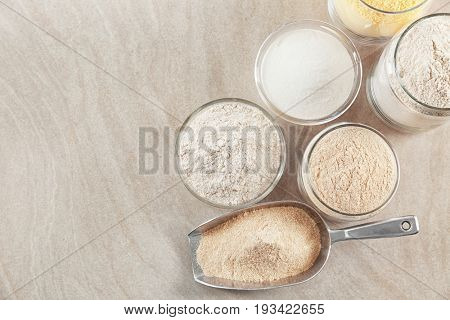 Composition with different types of flour on table