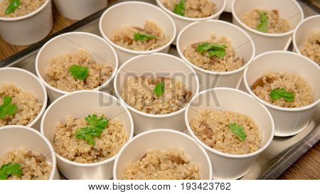 Brown Rice Is Divided Into Portions Close-up. Macrobiotics And Healthy Nutrition.