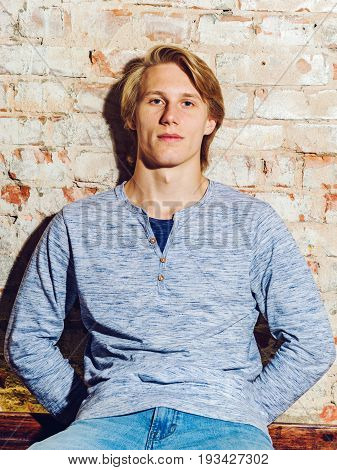 Young caucasian attractive guy posing in studio