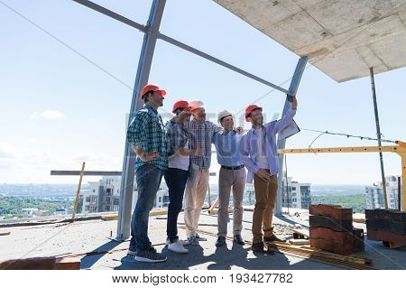 Team Of Builders Happy Smiling Take Selfie Photo During Meeting With Architect And Engineer On Construction Site Over City View Background