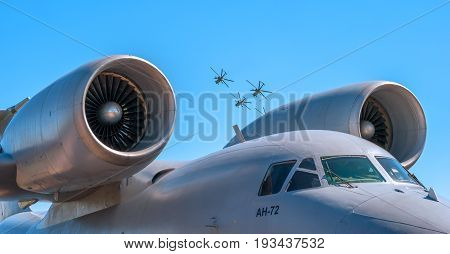 Pushkin, Russia - June 5, 2017: The jet engine of the Russian plane is An 72. Close-up. In the background, helicopters perform aerobatics.