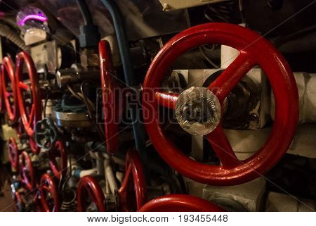 Kaliningrad, Russia - June 12 2017: Close-up View Of Red Valves Of Different Sizes, A Machinery Engi