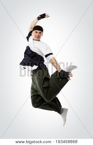 Hip-hop dancer jumping, isolated on white with clipping pach. Studio shoot.