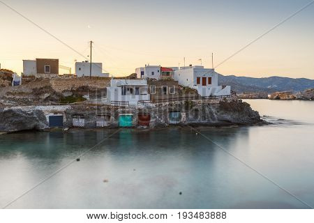 Boat houses in fishing village of Goupa on Kimolos island in Greece.