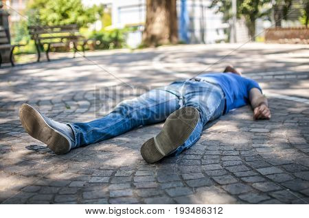 unconscious guy after heart attack in the outdoor