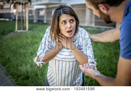 guy helping a girl chocking during feeding