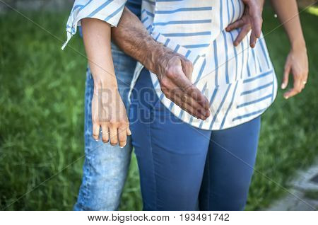 guy making the heimlich maneuver to a girl while she's chocking