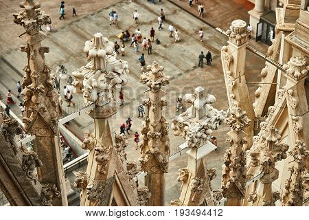 Blurred tourists on the square around the Milan Cathedral