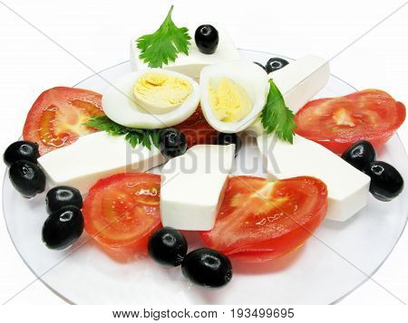 mediterranean breakfast made of tomato cheese egg and olive