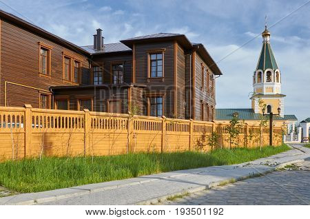 Wooden buildings and road at old town, Yakutsk, Russia.