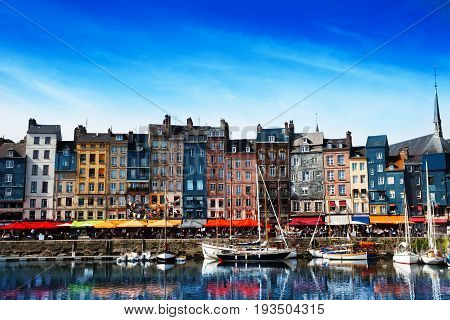 Waterfront of Honfleur harbor with color houses in Normandy, France
