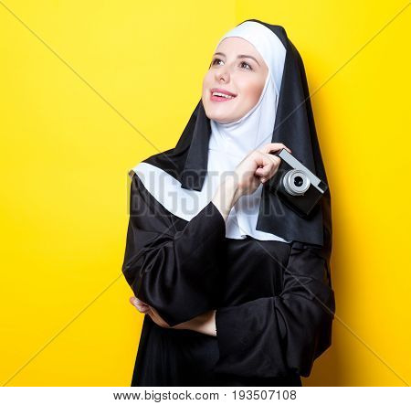 Young Happy Nun With Vintage Photo Camera