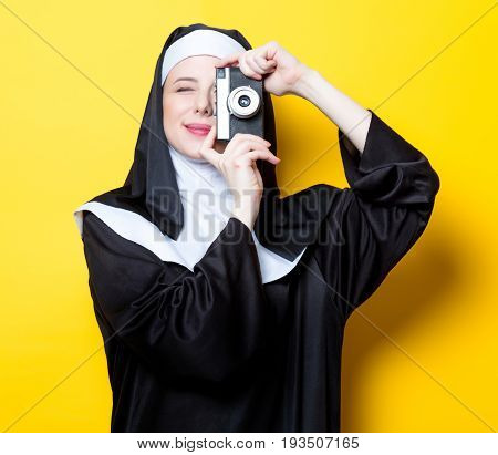 Young Happy Nun With Vintage Photo Camera